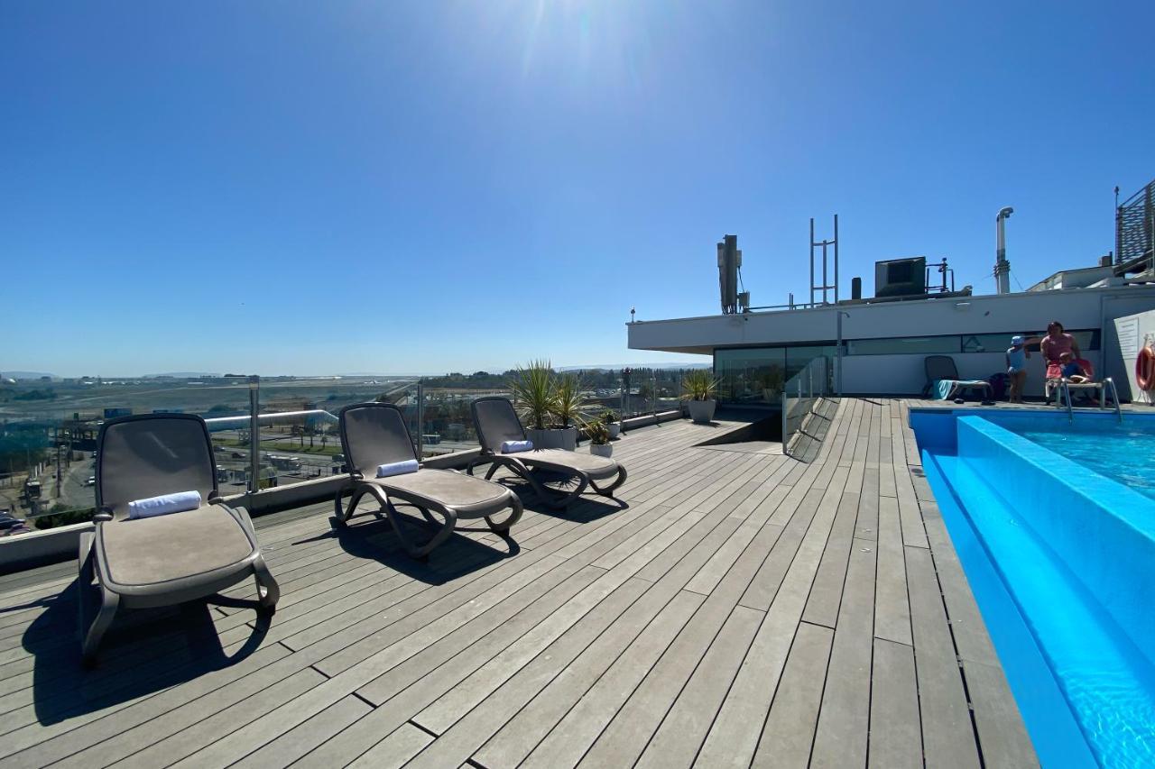Wyndham Concepcion Pettra Hotel Exterior photo Rooftop pool at the hotel