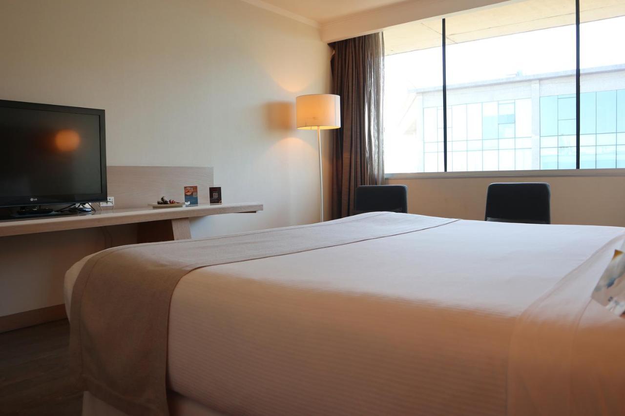Wyndham Concepcion Pettra Hotel Exterior photo A room at the hotel